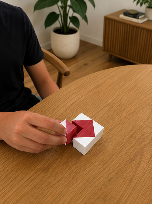 photo of a boy's hand playing with a puzzle